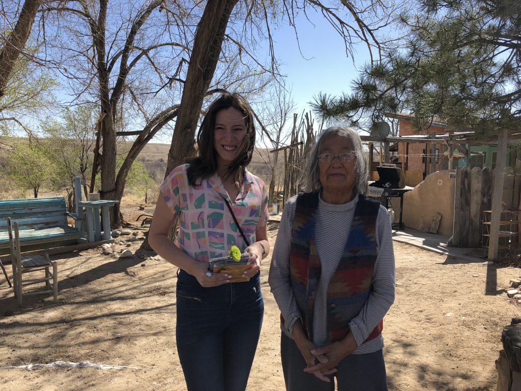 My niece and artist-poet Gloria Emerson outside her adobe house