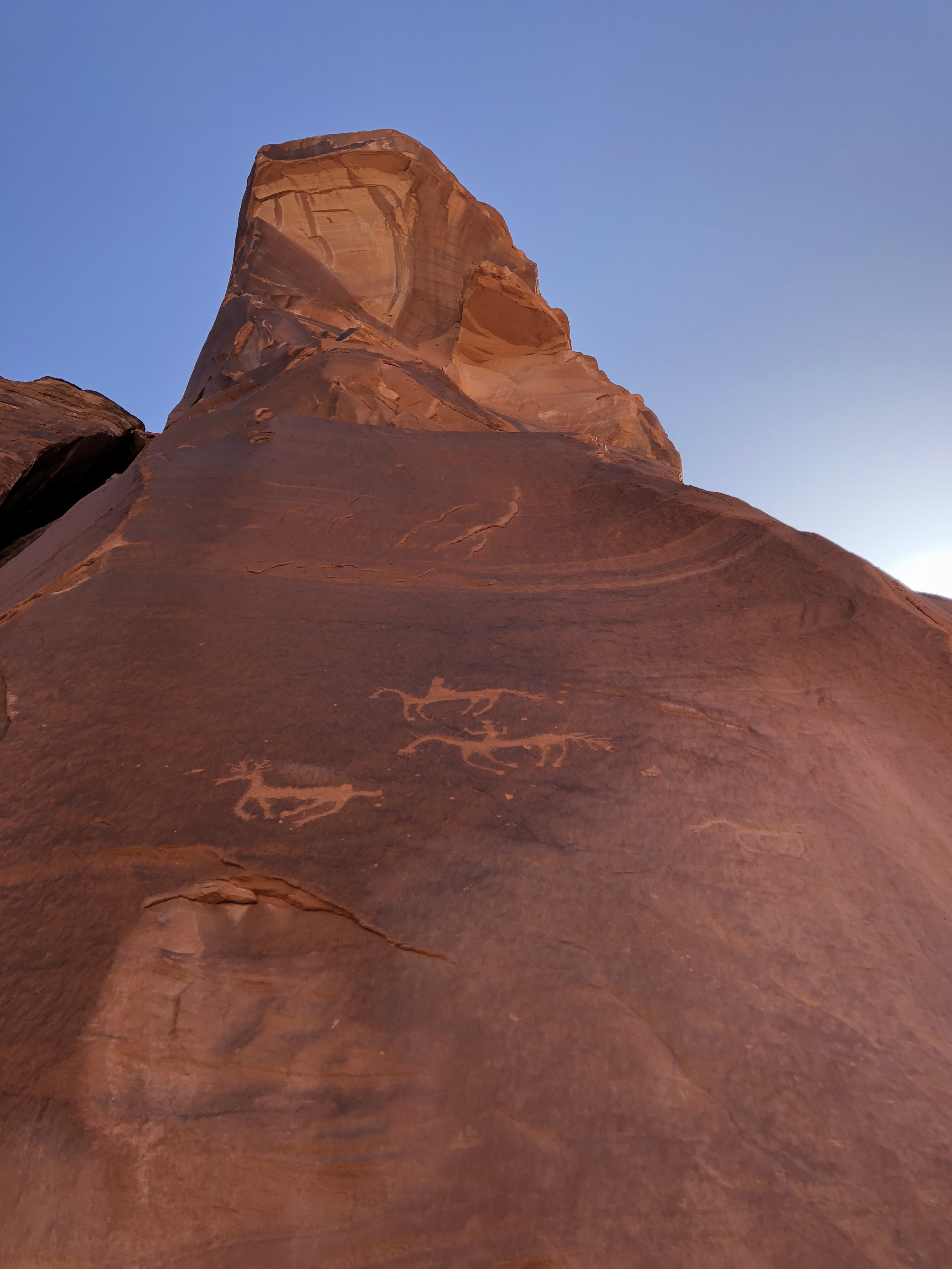 Petroglyphs on a sunlit rock in Canyon de Chelly, Navajoland